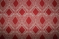 Preview: Dekostoff grafisches Muster Leinen Look rot (10 cm)